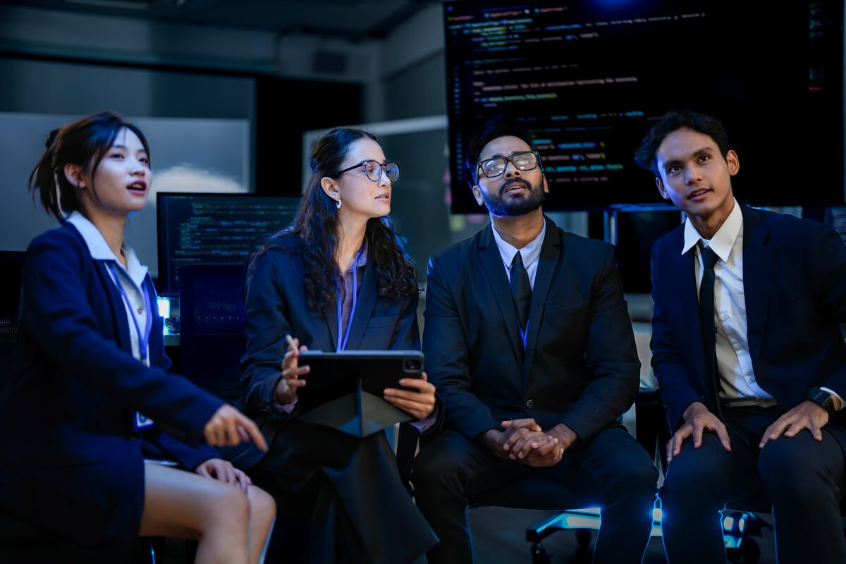 diverse team of ai strategists in a project huddle 3KK9DUL